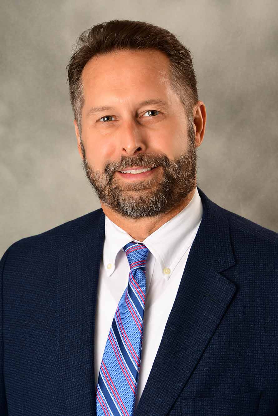 Headshot of CID Director Marty Lenss